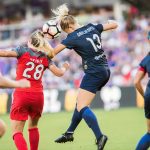 Amandine Henry and Abby Dahlkemper vie for the ball. (Monica Simoes)