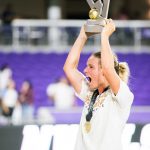 Amandine Henry lifts the championship trophy. (Monica Simoes)