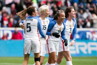 Kelley O'Hara, Megan Rapinoe, and Andi Sullivan celebrate Mallory Pugh's goal (11) during the 2018 SheBelieves Cup. (Monica Simoes)