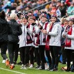 The U.S. Women's National Hockey Team greets the U.S. Women's National Soccer Team during warmups at the 2018 SheBelieves Cup. (Monica Simoes)