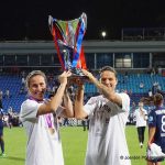 Camille Abily and Dzsenifer Marozsán lift the Champions League trophy after defeating Wolfsburg, 4-1. (Daniela Porcelli)