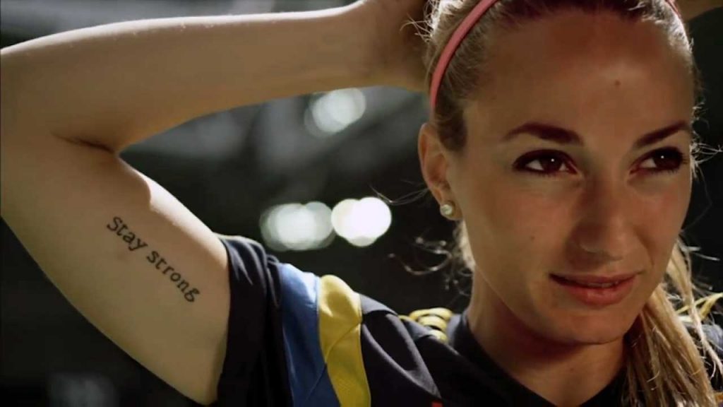 Kosovare Asllani close up with tatto of Stay Strong. 