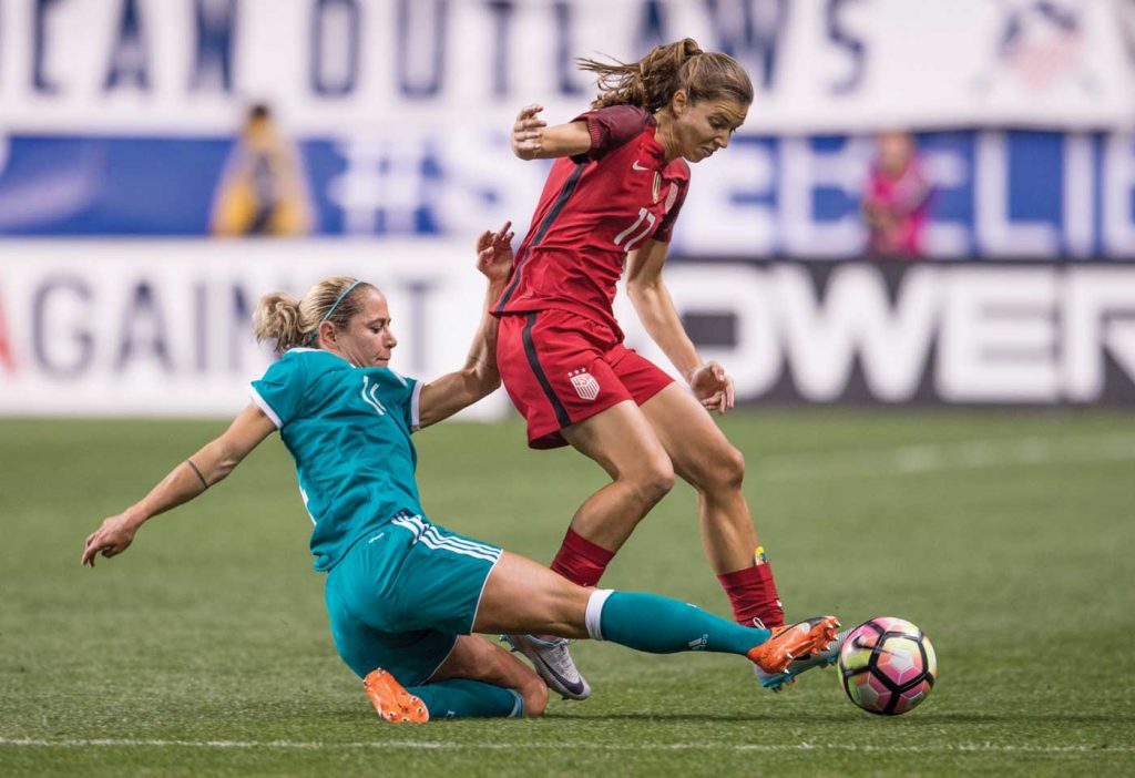 Tobin Heath of the U.S. Women's National Team, avoiding a tackle. (Brad Smith /ISI)