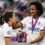 Lyon's Dzsenifer Marozsán and Wendie Renard with the Champions League trophy. (Daniela Porcelli / OGM)