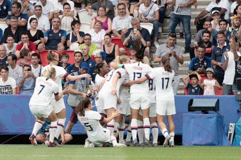 The USWNT celebrates after scoring against France in the 2019 World Cup. (Manette Gonzales)