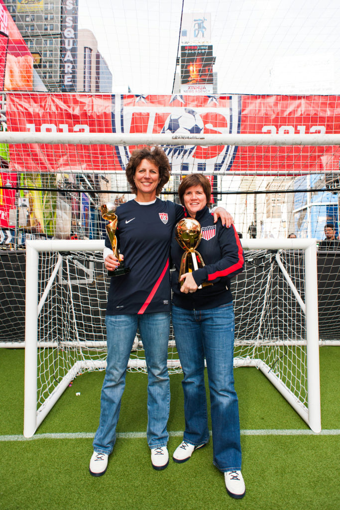 U.S. Women's National Team legends Michelle Akers and April Heinrichs with World Cup trophies. (Howard C. Smith / ISI Photos)