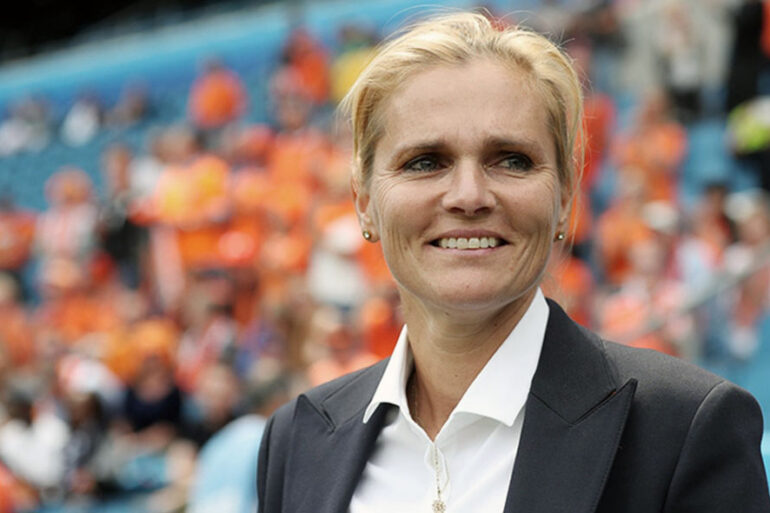 Head coach of The Netherlands, Sarina Wiegman smiling on the sideline. (The FA)