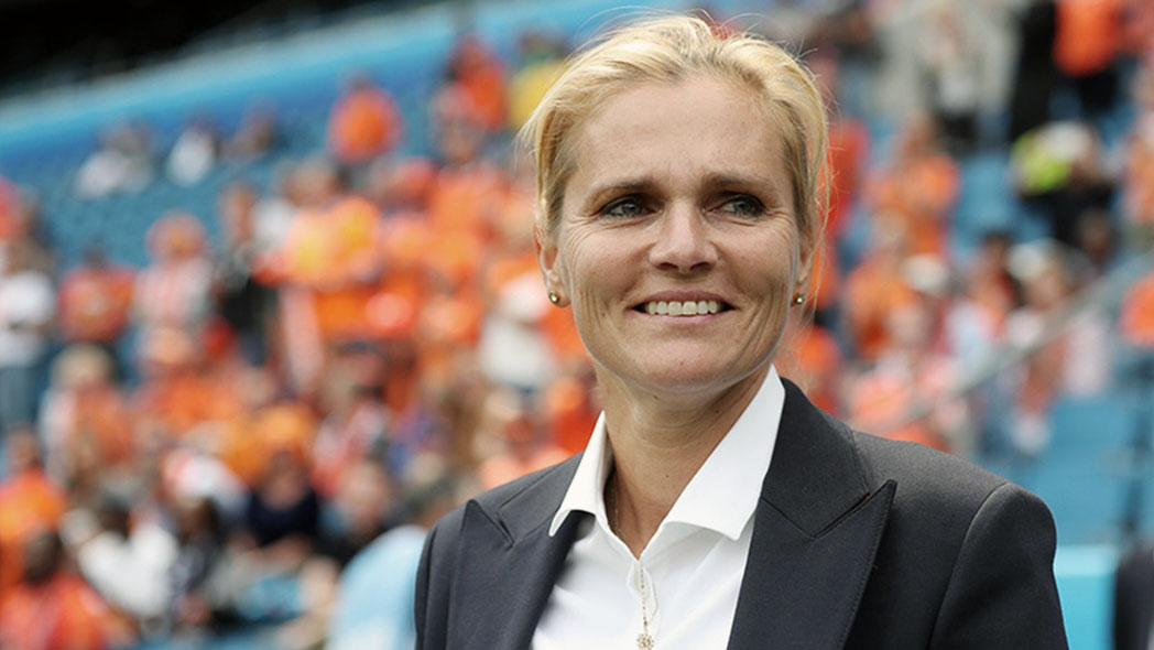 Head coach of The Netherlands, Sarina Wiegman smiling on the sideline. (The FA)