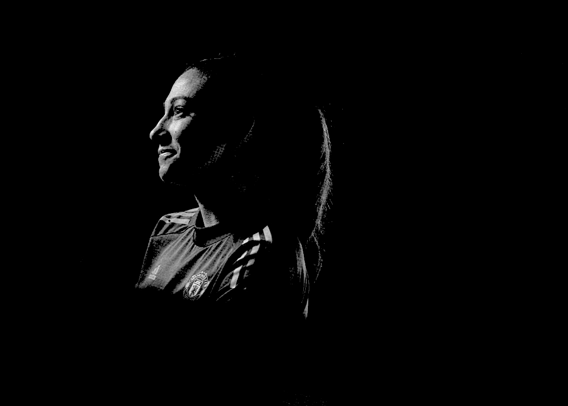 Christen Press in black-and-white silhouette wearing Manchester United kit. (Manchester United)