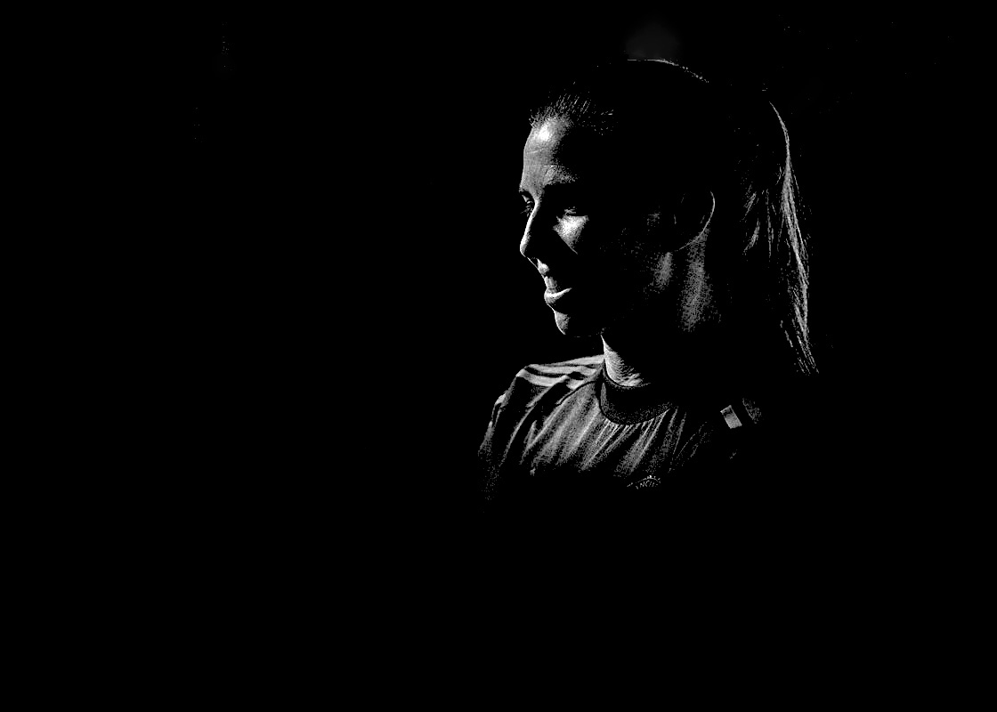 Tobin Heath in black and white silhouette and Manchester United kit. (Manchester United)