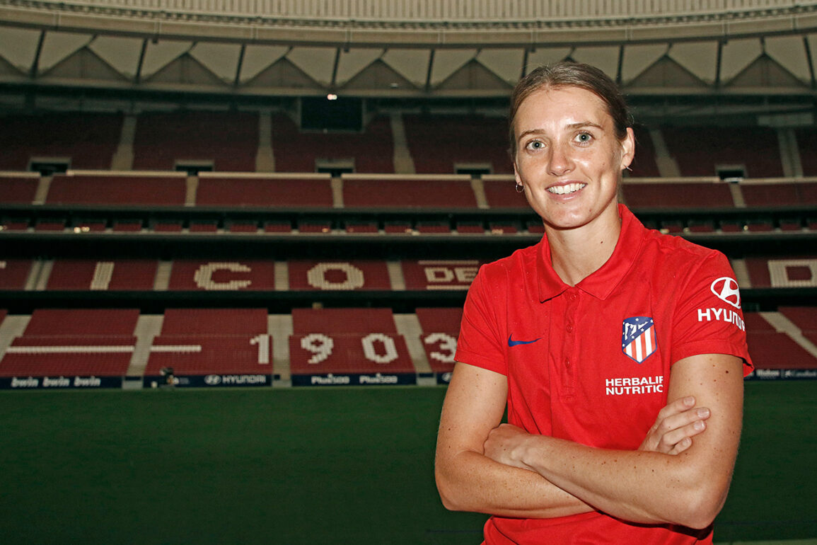 Jade Moore in Atletico Madrid polo shirt with the stadium as a background. (Atletico Madrid)