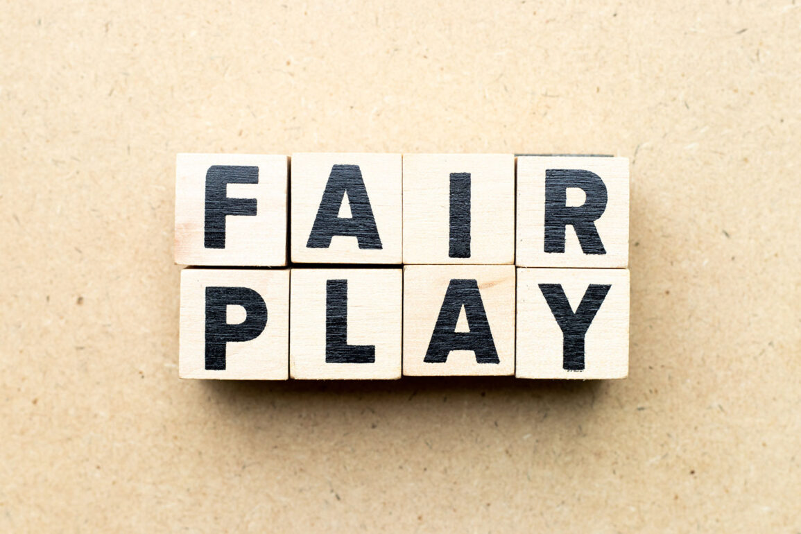 "Fair Play" spelled out in wooden blocks.