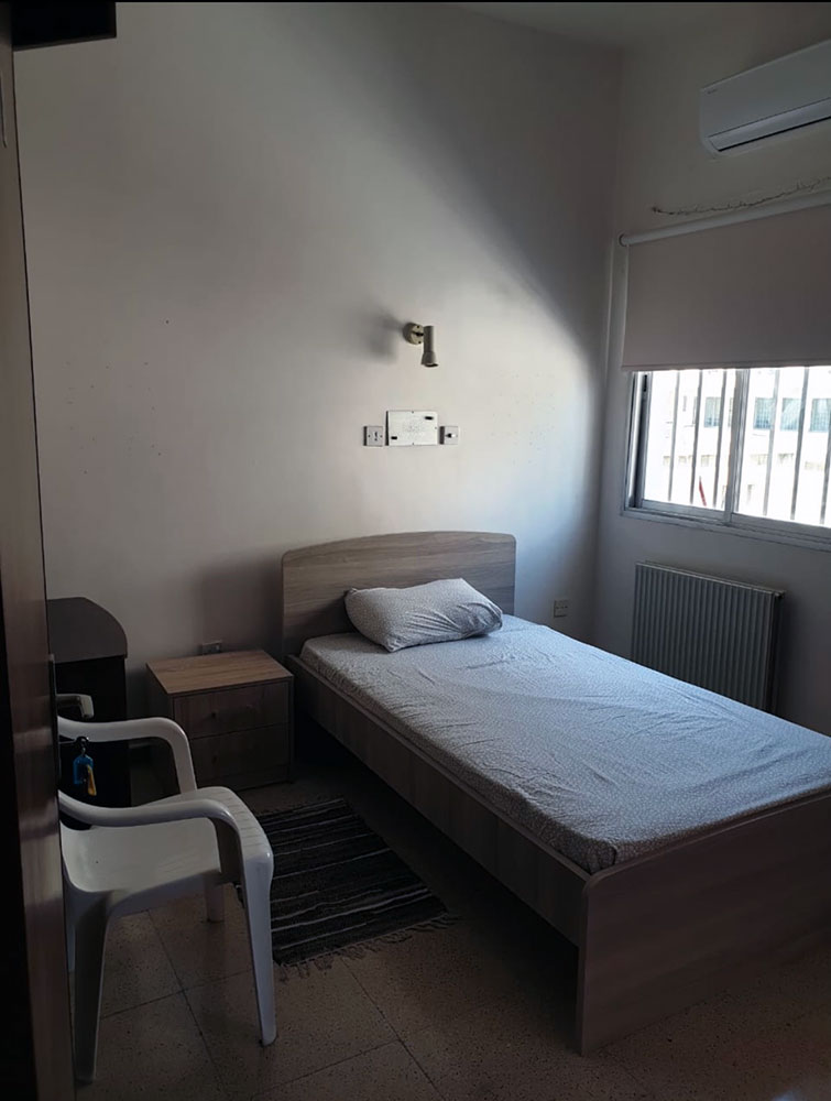 Image of small bedroom with window taken by Havana Solaun of her lodgings in a former psychiatric institution while playing in Cyprus. (Havana Solaun)