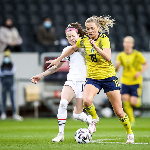Sweden's Fridolina Rolfo on the ball against Rose Lavelle and the United States. (Mia Eriksson)