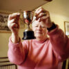 Lesley Lloyd, captain of the inaugural Women's FA Cup winners Southampton, holds a replace trophy while reminiscing about the 1971 final. (The FA)