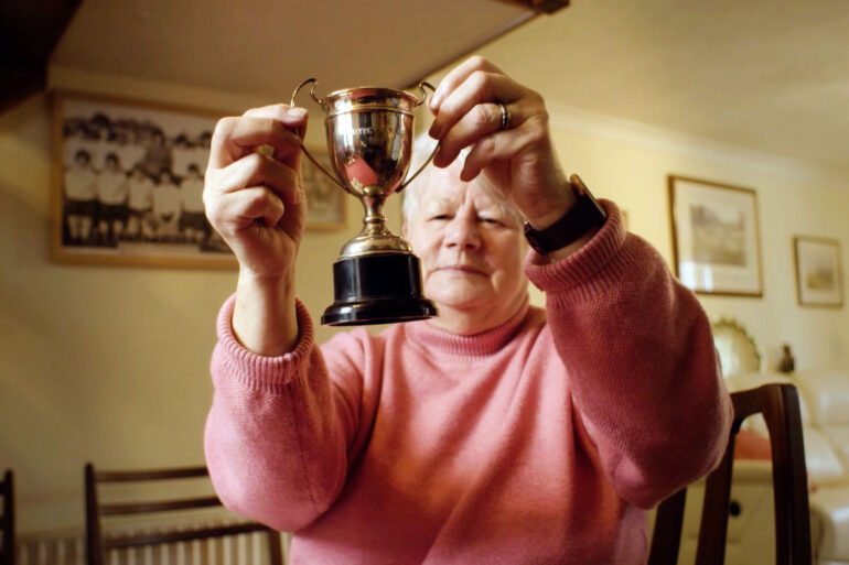 Lesley Lloyd, captain of the inaugural Women's FA Cup winners Southampton, holds a replace trophy while reminiscing about the 1971 final. (The FA)